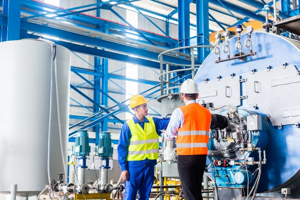 General Manufacturing Plant personnel inspecting industrial process equipment