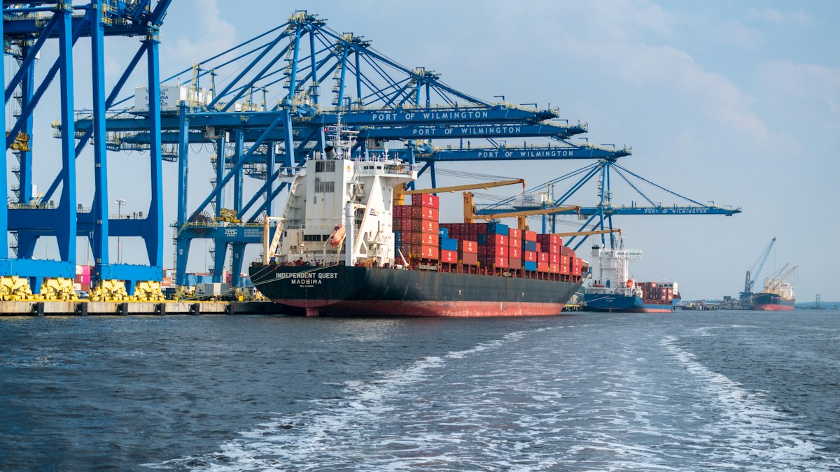 Marine & Ports Container ship alongside cranes at a working cargo terminal